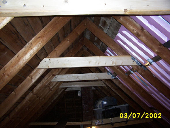 I'll probably remove the last two crossbeams on my next work day.  It'll make it more difficult for me to get up into the attic, as I use the on nearest the entryway to pull myself up, but I'll manage.