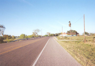 FM-88 as you are traveling north, approaching the Delta Lake Park entrance.  Just past the entrance to the park is the bridge, with portions of Delta Lake on both the east and the west sides of the road.    Further north is the Willacy County line.