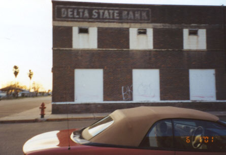 The Delta State Bank building, on N Hill and Southern, has been closed for several years, the inside gutted by fire.
