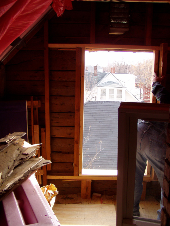 Since everything seems to fit, Steve is removing the window temporarily so that we can nail the frame in place.