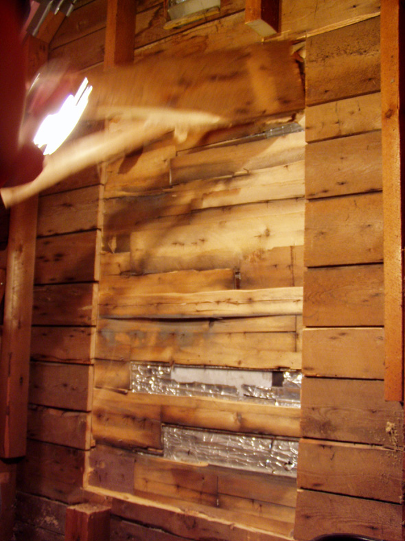 We've cut through the first layer of the wall. Left is one layer of cedar shingles and a layer of siding.