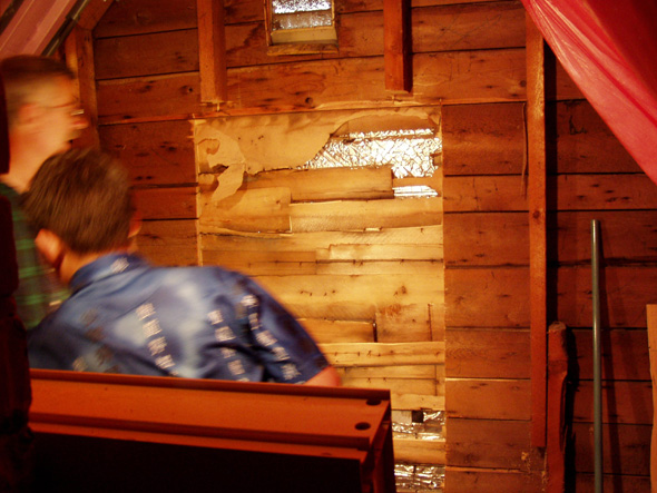 At this point we're deciding whether to remove the outside siding first or to cut through it.