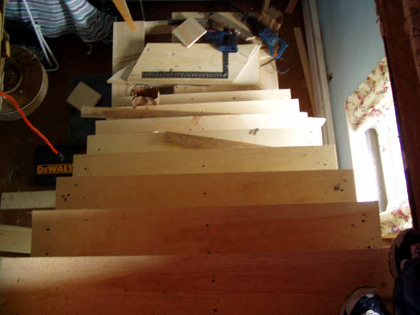 From the attic, you can see the stairs and the unfinished landing.