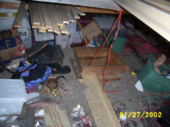 Without the inclination to bring all of this junk back down the stepladder, I had to work around it until I could put in a floor that was large enough to stack it on.  Part of the floor had adequate insulation, but much of it had only a couple of inches of badly deteriorated insulation material.  Before starting on the floor, I laid new insulation in the parts of the floor that needed it.