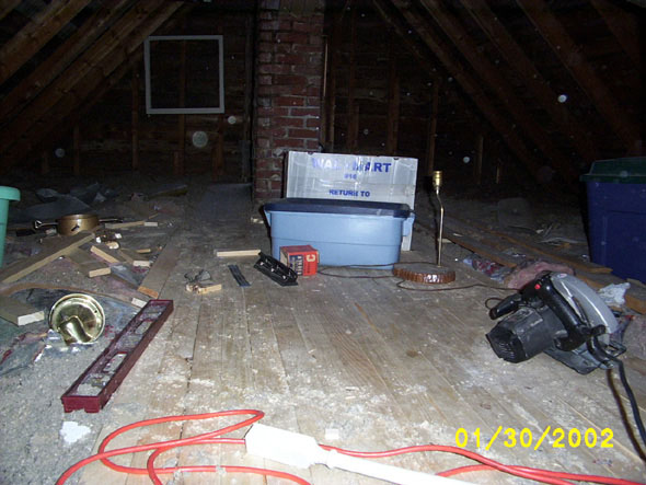 The hard part, or one of the harder parts, anyhow, around the entryway and chimney, is done.  I also have some floor space upon which to lay my tools, a welcome relief after having lost a few of them in the insulation.