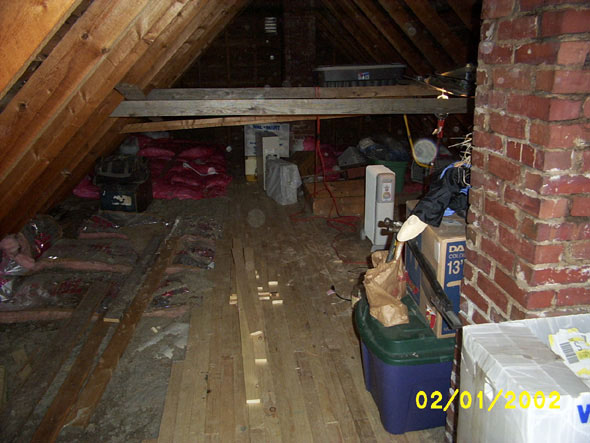 From a vantage point to the west of the north chimney and facing south, you can get an idea of the amount of extra living space a finished attic will give us.  Once completed, Denny will have the largest bedroom in the house.  Currently, the roof support beams are low, only a few feet off the floor, but I've spoken to a contractor who has done some work for us downstairs, and he has told me that I could move them up, even to within 16 inches of the crest of the roof.  I won't need to go up that far with them in order to give us enough headroom.