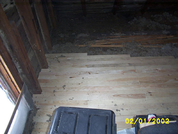 On the north end of the attic, facing east.  I've stacked most of the stored junk onto the completed parts of the floor.