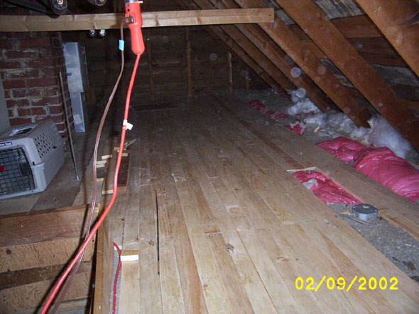 On examination, I've found that whoever had originally insulated the attic packed the insulation material down into the eaves, an error which may have contributed to our problems with ice damming.  As I finish off the floor and begin on the insulation, I'll be pulling as much of it up out of there as possible.