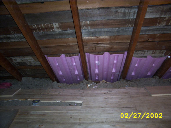 Sliding the attic rafter vents as far into the eaves as I can.