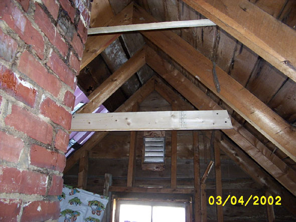 Okay, back to work.  The first crossbeam is in place.  Not a perfect fit, but it'll work and I'll get better as I go along.