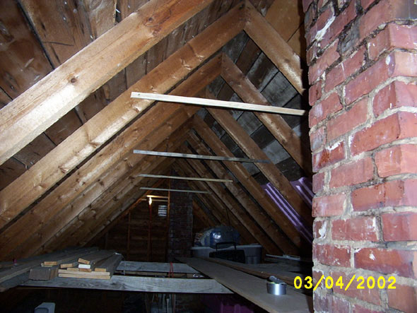 I've added some positioning strips to every other rafter in preparation for moving the crossbeams up to about 18 inches from the crest.