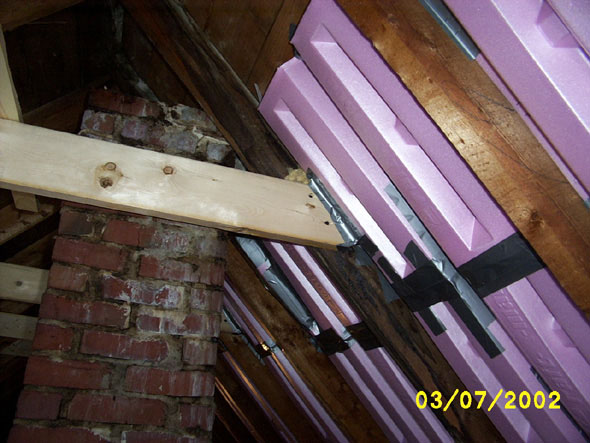 Since I decided to leave the inactive chimney in place, at least for now, it will enter the new attic space, giving the appearance of a full chimney, since no one will be able to see that it ends a few inches short of the roof.