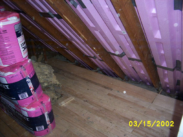 I've finished with the floor.  Once I've put the insulation in over the prop vents, the boards that will go over the top of them will fill in the space between the last floor board and the wall.  At any rate, the space in the eaves will be blocked in by a storage space, or used for shelves and the like.