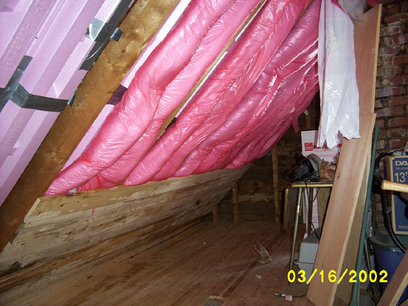 In the northwest corner, the insulation is in and I've started to lay the wall.  I'll be adding loose insulation on the sides of each roll of insulation.