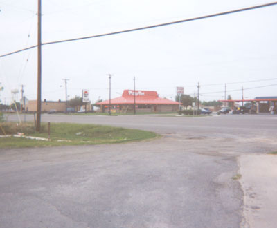 Pizza Hut is east of Whataburger.  Further east is a coin laundry and dentist office.