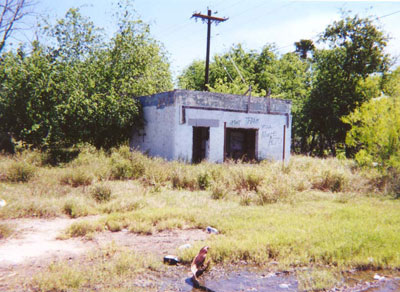 Located on the east side of FM-88, just south of the old Magues Cafe, I dont know what this building used to be.