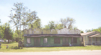 Located on Lackland Street, across from Longorias, this building appears yet to house a beauty parlor.