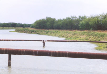 Right and below -- a view of the canal that crosses FM-1422 between Marro Road and FM-1015.