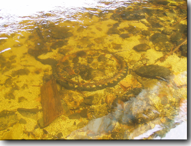 An old wheel with a little bit of rubber remaining.