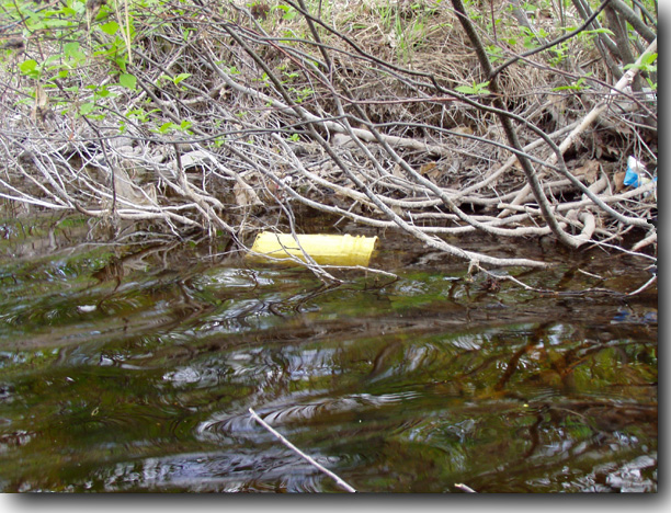 Another yellow five-gallon plastic drum.