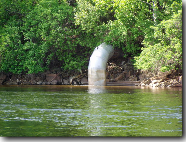 Aluminum tube leading into the stream from the mill side.