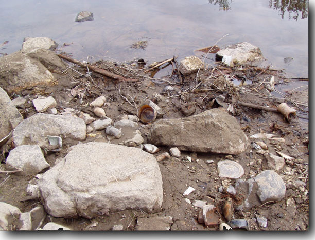 More glass, ceramic, and metal debris.