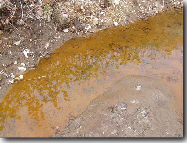 Rust-red water.